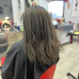 Completely natural hair blow dried and round brushed before trim (no roller set)