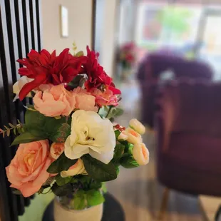 a vase of flowers on a table