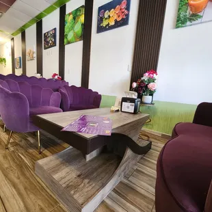 purple chairs and a coffee table