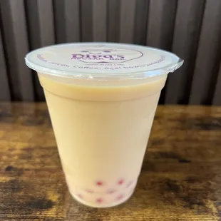 Mango Milk tea with strawberry boba.