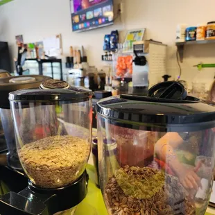 two blenders filled with cereal