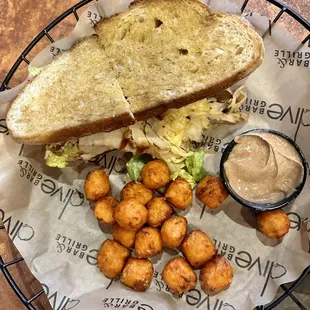 Sandwich with sweet potato tots.