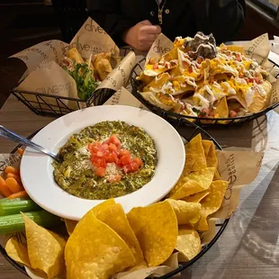 a plate of chips and a bowl of salsa