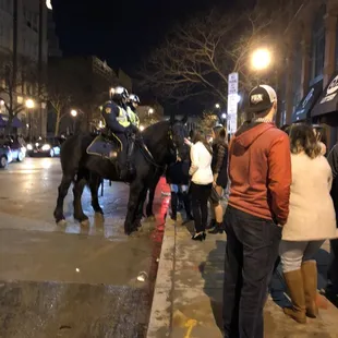 a group of police officers on horseback