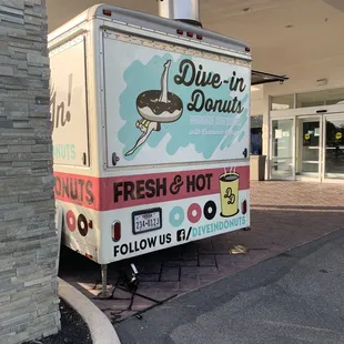 a food truck parked in front of a building