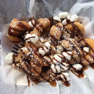 S&apos;mores mini donuts with powdered sugar.