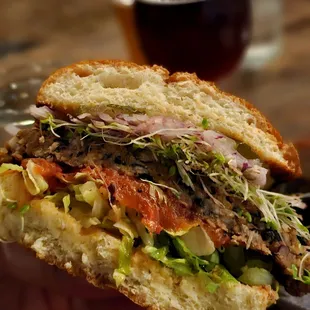 Inside the house-made veggie burger (minus cheese &amp; sauce to make it vegan). Tasty patty, but a plant-based sauce would make it better.