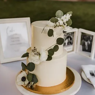 a wedding cake with white flowers