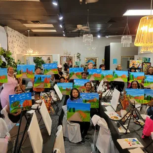 Group photo of "Hello Autumn." Several of the students have never painted before that day!