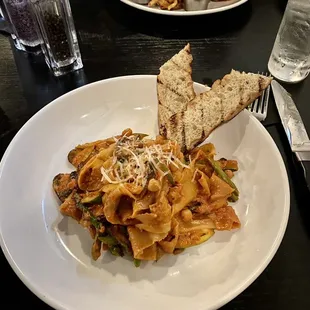 a plate of pasta and bread