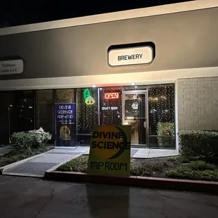 a sign in front of a building