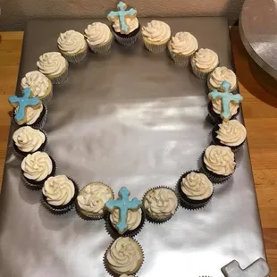 a cross and cupcakes