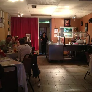 people sitting at tables in a restaurant