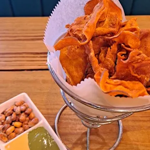 a bowl of chips and dips