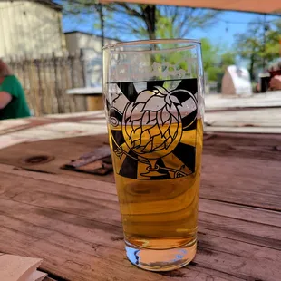 a glass of beer on a table