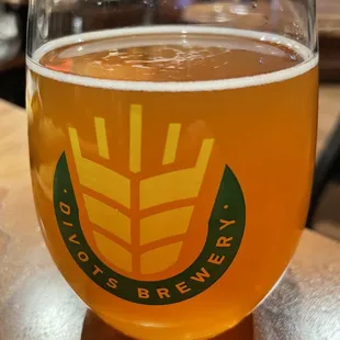 a glass of beer on a table