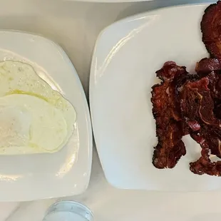 bacon and eggs on a white plate