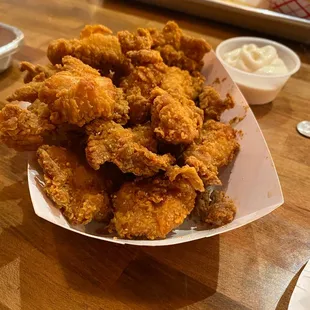 a basket of fried chicken and fries