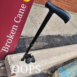 a broken cane on a sidewalk