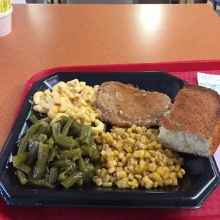 Boneless pork loin, Mac n cheese, green beans, corn and cornbread. They bill the Pork loin as Tenderloin, but it's not.