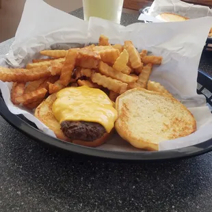 cheeseburger and fries in a basket