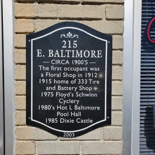 a plaque on the side of a building