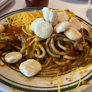 a plate of spaghetti and mushrooms