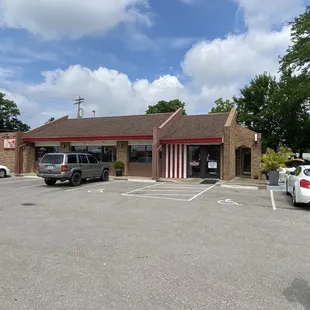 a man walking in a parking lot