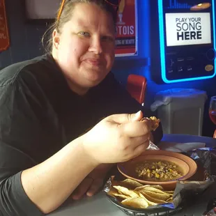My wife getting ready to dive into some white chili.