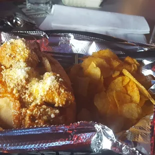 Meatball hoagie with bbq chips.
