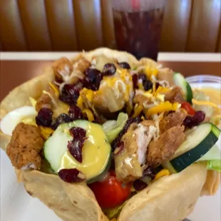 Chicken breast salad with fried chicken strips.