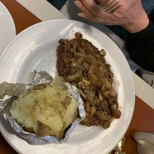 Chop sirloin with mushrooms and onion and a baked potato