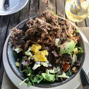 Garden Chopped Bowl - (thick cut) house bacon, hard boiled egg, corn, red onion, tomato, avocado, bleu cheese &amp; added Pulled Pork.