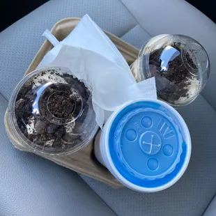 two cups of coffee and a tray of cookies