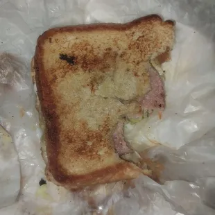 The hot ham and cheese sandwich before opening it.