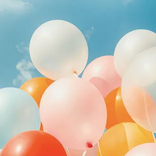 a bunch of balloons in the sky