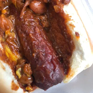a hot dog with chili and beans