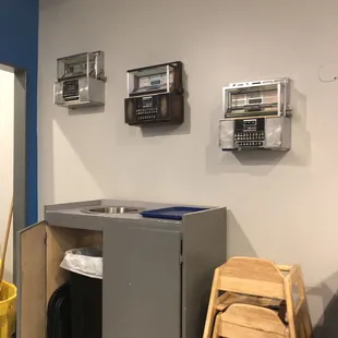 a laundry room with a sink and a washer and dryer