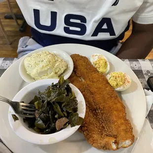 Catfish, potato salad, greens and deviled eggs.