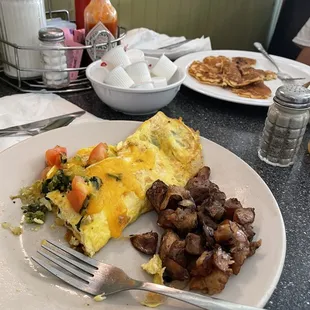 Veggie omelette with home fries