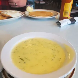 Broccoli cheese soup, pancake in back