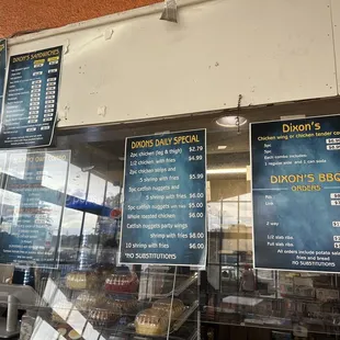 menus and prices in a store window