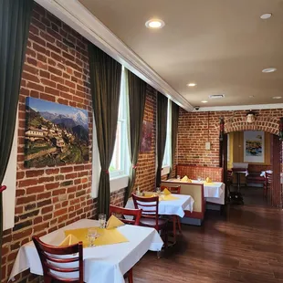 a dining room with tables and chairs