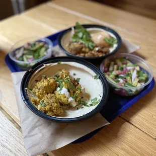 three plates of food on a table