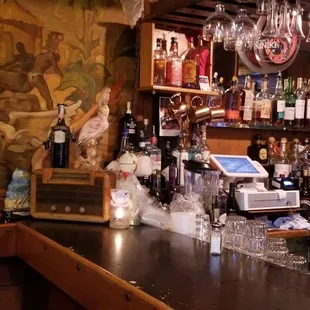 a bar with many bottles of alcohol