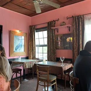 Inside. Small. Pink. Needs new paint.