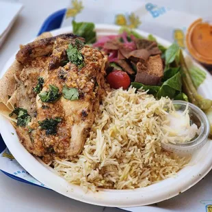 Quarter bird with rice and salad