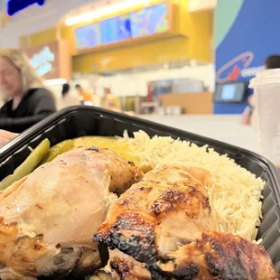 Half chicken plate with potatoes and rice