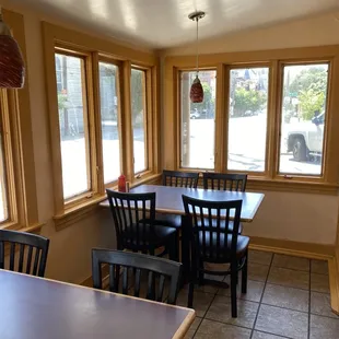 a dining room with a table and chairs