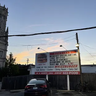 a sign in front of a church